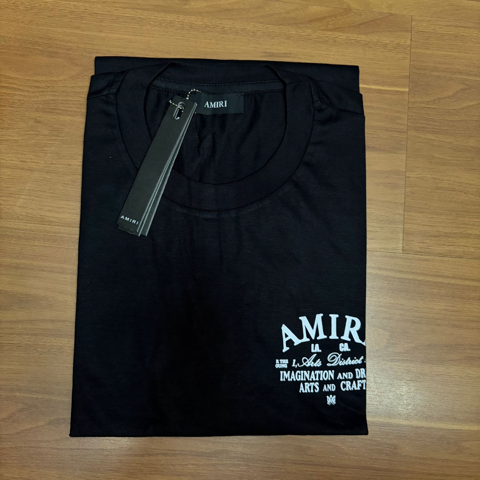 Camiseta Premium Amiri Arts Dishied Preta Estampa na Costas